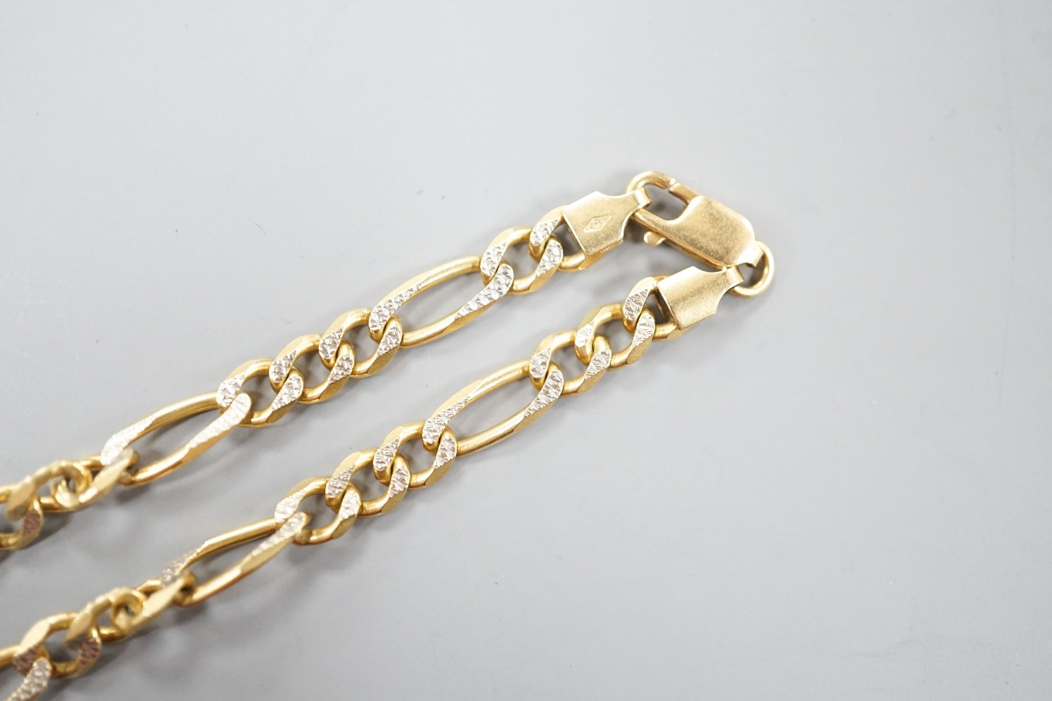 A modern 750 two colour yellow metal curb link chain, 46cm, 22. 8 grams.